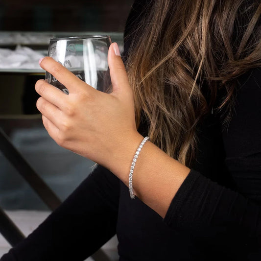 The Solara Bangle | Tennis Design Moissanite Bracelet shines elegantly on a wrist, enhancing any sophisticated look.